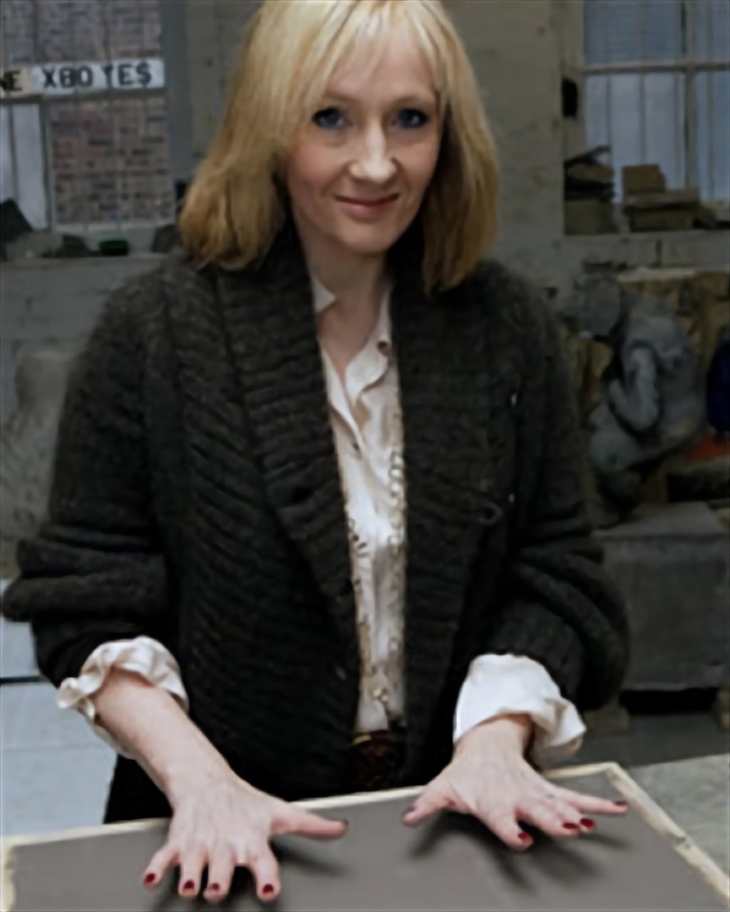 JK Rowling is being guided by the Edinburgh Award sculptor in his workshop