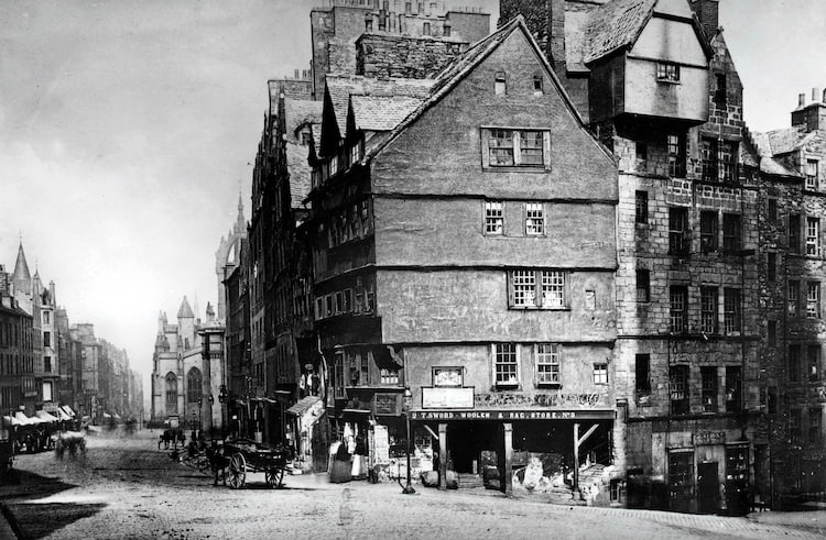Timber framed tenements overhang the West Bow
