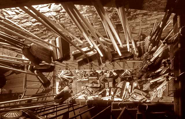 40 Victoria Street view down the stairwell packed with brooms at Robert Cresser's brush & broom shop Edinburgh