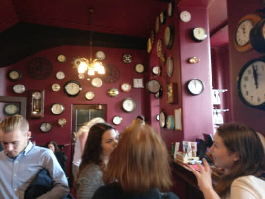 the Palace theatre bar is decorated with clocks