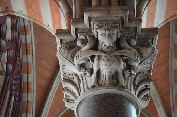 The symbol of the Midlands railway company a Wyvern decorates a column at St Pancras station